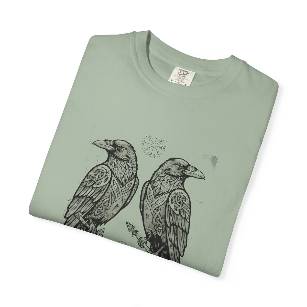 Folded sage green Hávamál tee showing the woodcut raven print