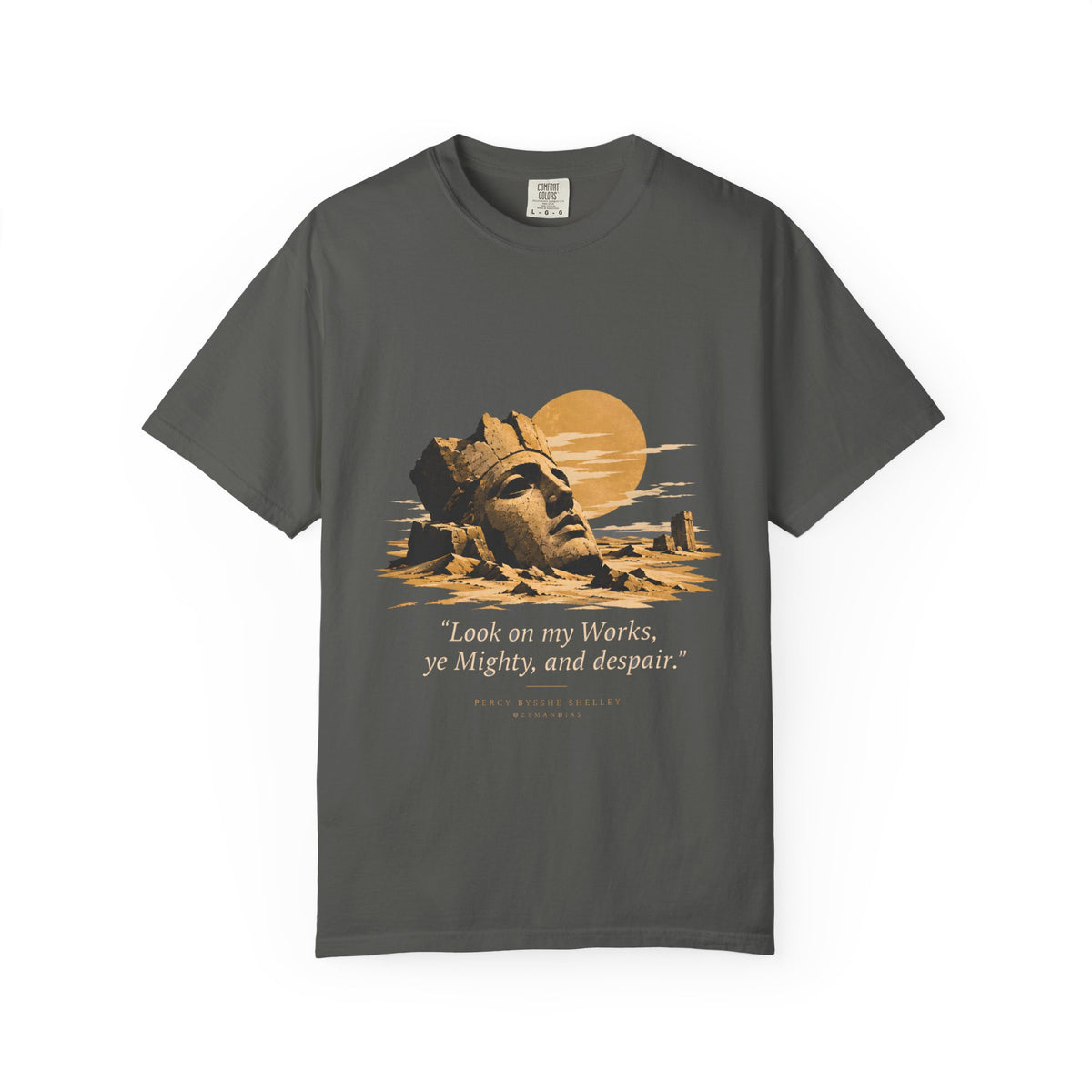 Ozymandias t-shirt by Palimpsest — Shelley's shattered stone colossus half-buried in the desert with the sun behind, gold and sand on a grey tee