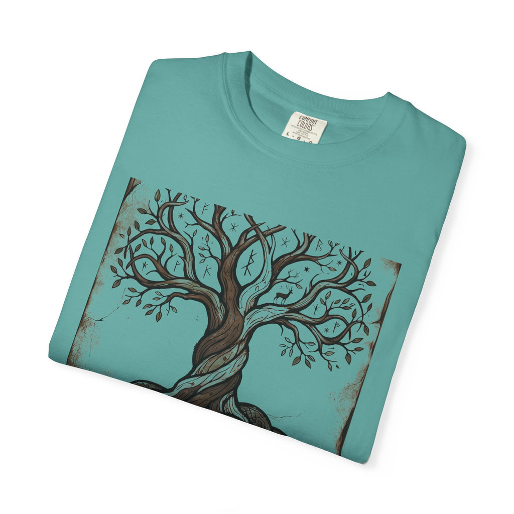 Folded jade green Völuspá tee showing the woodcut Yggdrasil print