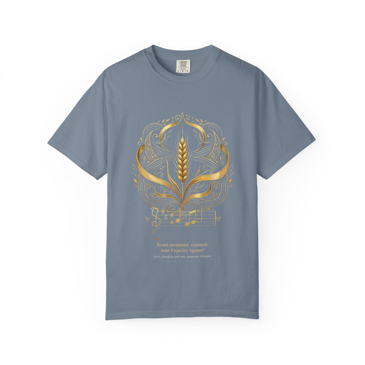 Prayer for Ukraine tee by Palimpsest — a gold wheat sheaf and art-nouveau scrollwork with the opening bars, on a denim blue shirt