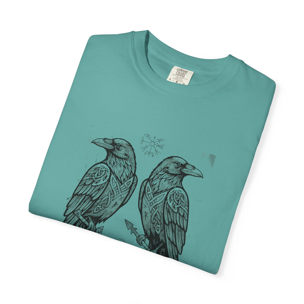 Folded jade green Hávamál tee showing the woodcut raven print
