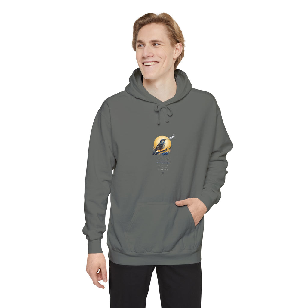 Man wearing the charcoal grey Chary Nochi hoodie by Palimpsest
