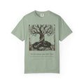 Völuspá tee by Palimpsest — a woodcut Yggdrasil above 'the sun turns black' in Old Norse, on a sage green shirt